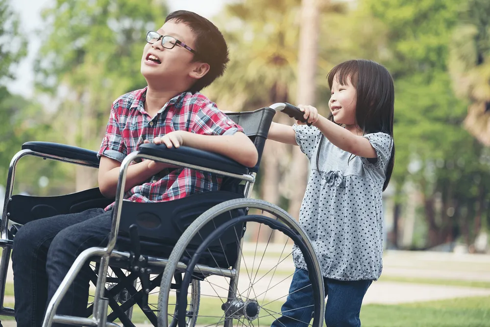 A therapist working with a young child during an early intervention session